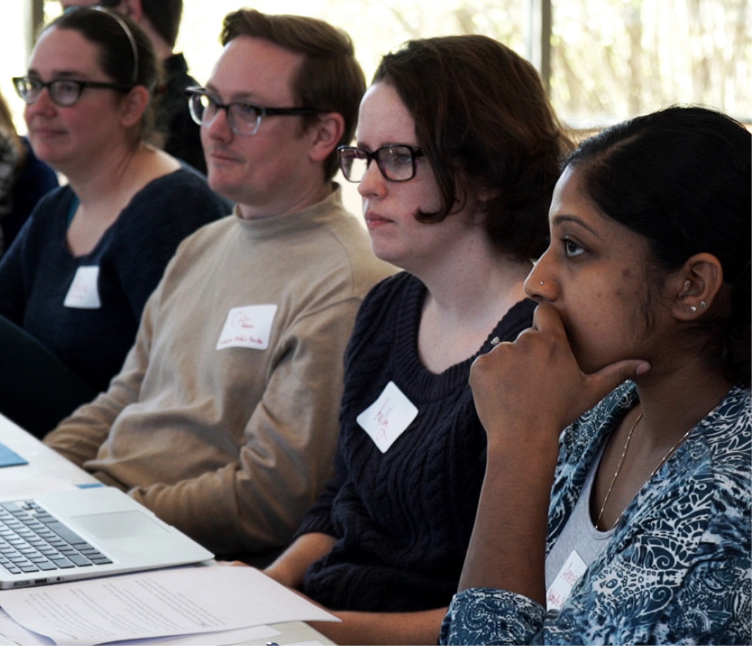 People sitting at table in training